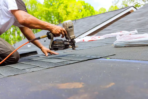 depositphotos_731732536-stock-photo-construction-roofer-operating-air-pneumatic
